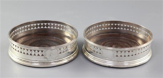A pair of George III pierced silver wine coasters, diameter 11.8cm.